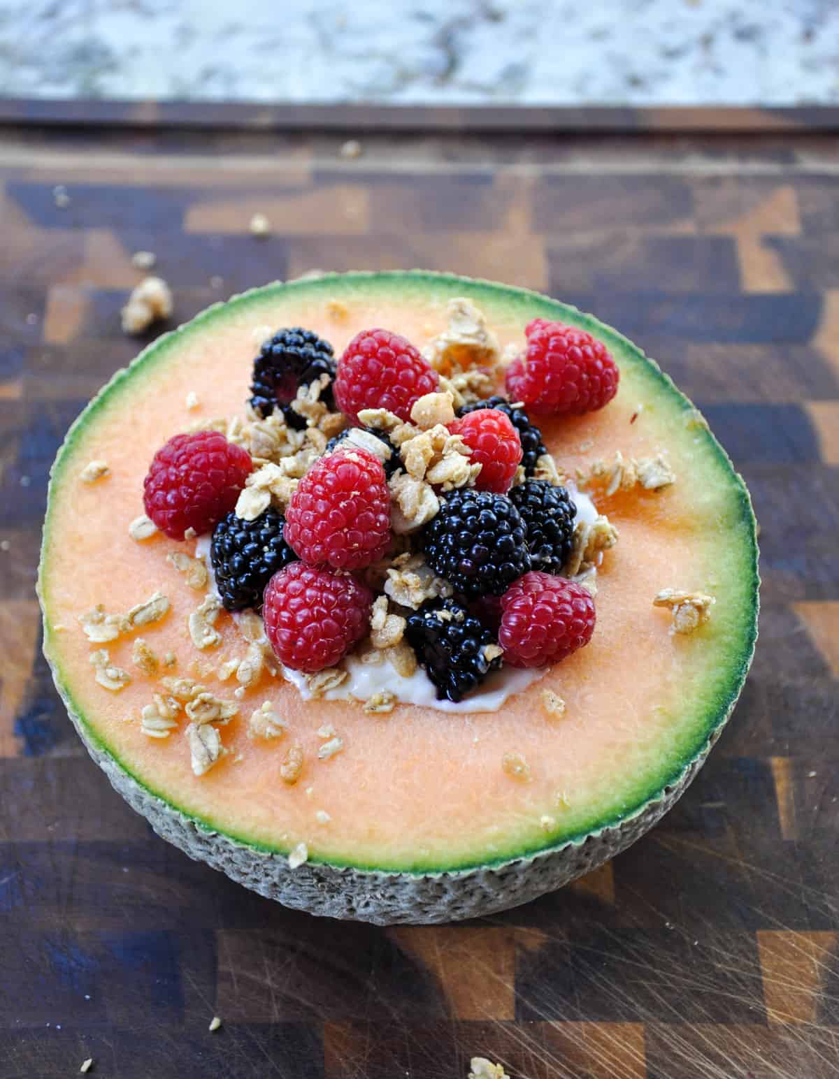 Cantaloupe Breakfast Bowls. Perfect for dessert too! Load the center with greek yogurt and top with fresh berries and granola. YUM!