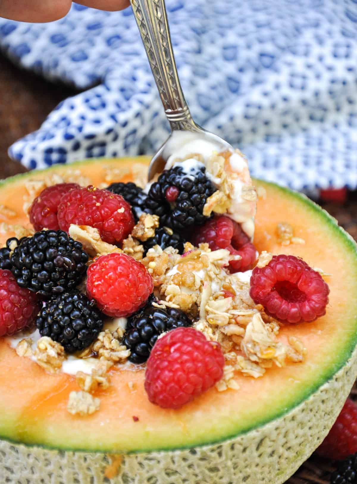 Cantaloupe Breakfast Bowls. Perfect for dessert too! Load the center with greek yogurt and top with fresh berries and granola. YUM!