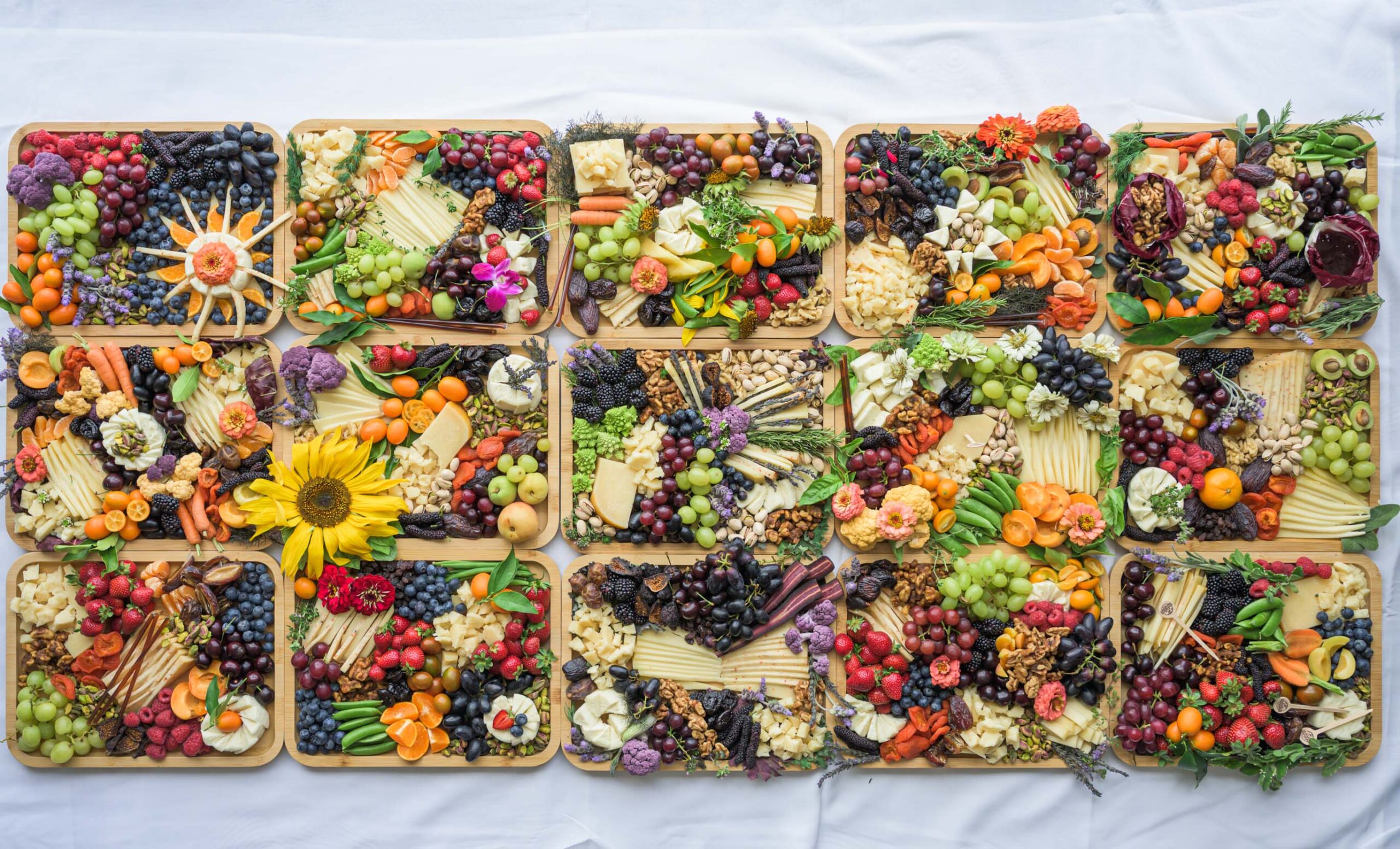A flat lay of 15 cheeseboards.
