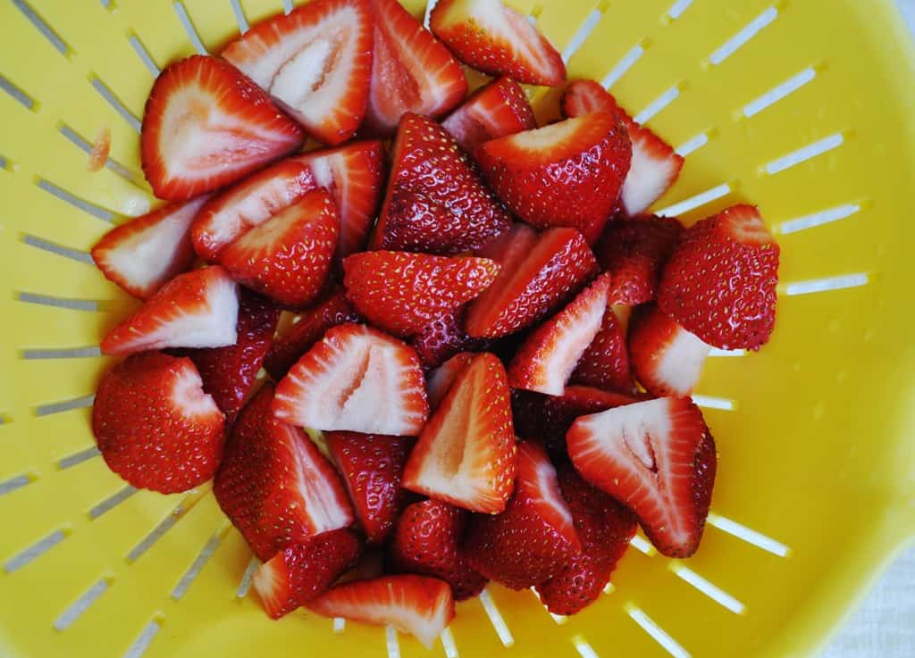 Washing strawberries in bowl