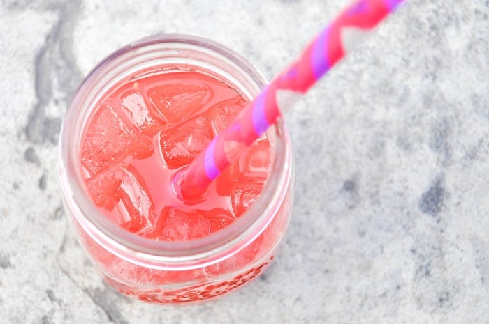 Close Up of Wild Watermelon Punch in Mason Jar with Straw