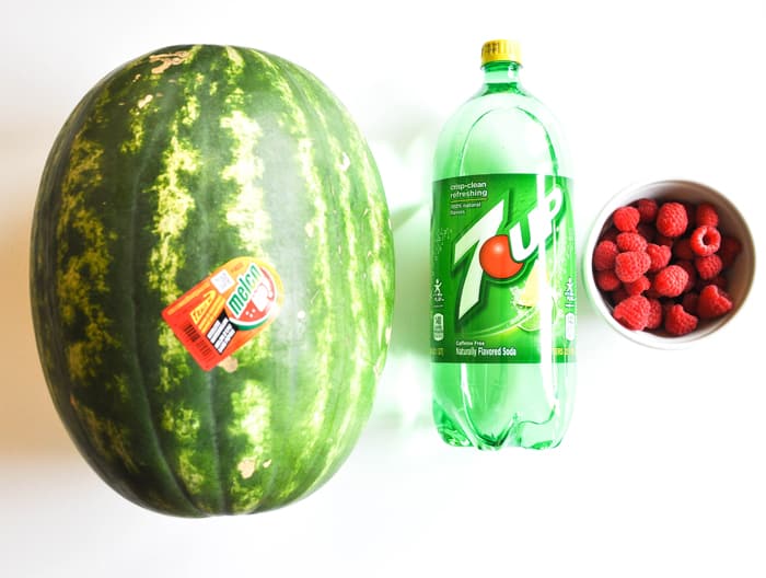 Wild Watermelon Punch Ingredients Laid Out: Watermelon, 7-Up, and Raspberries 