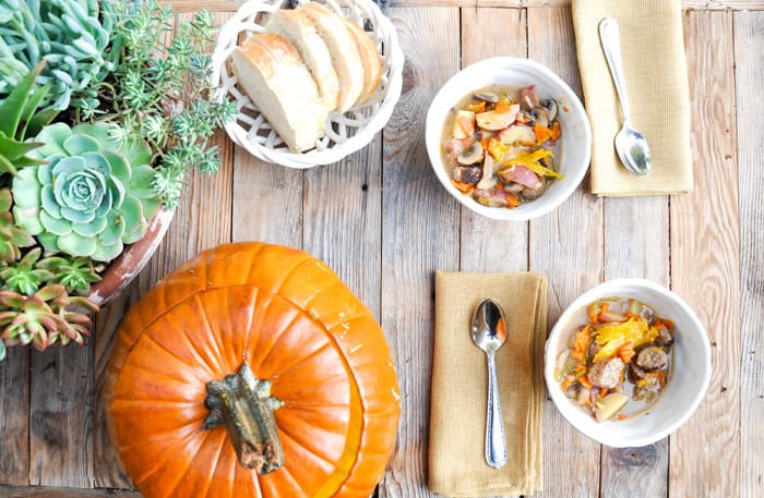 two bowls of stew and a pumpkin tureen