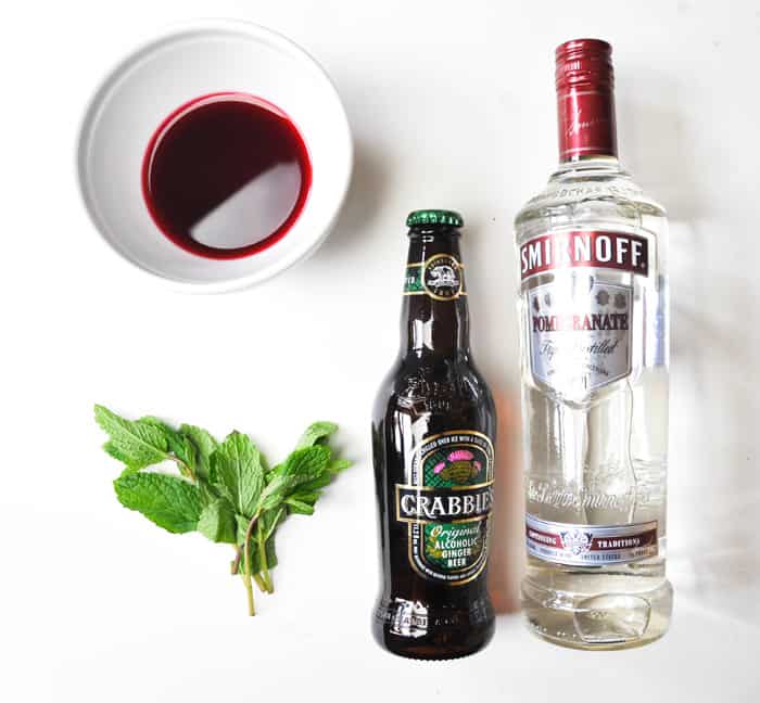 Ingredients, mint, pomegranate vodka, ginger beer, fresh pomegranate juice