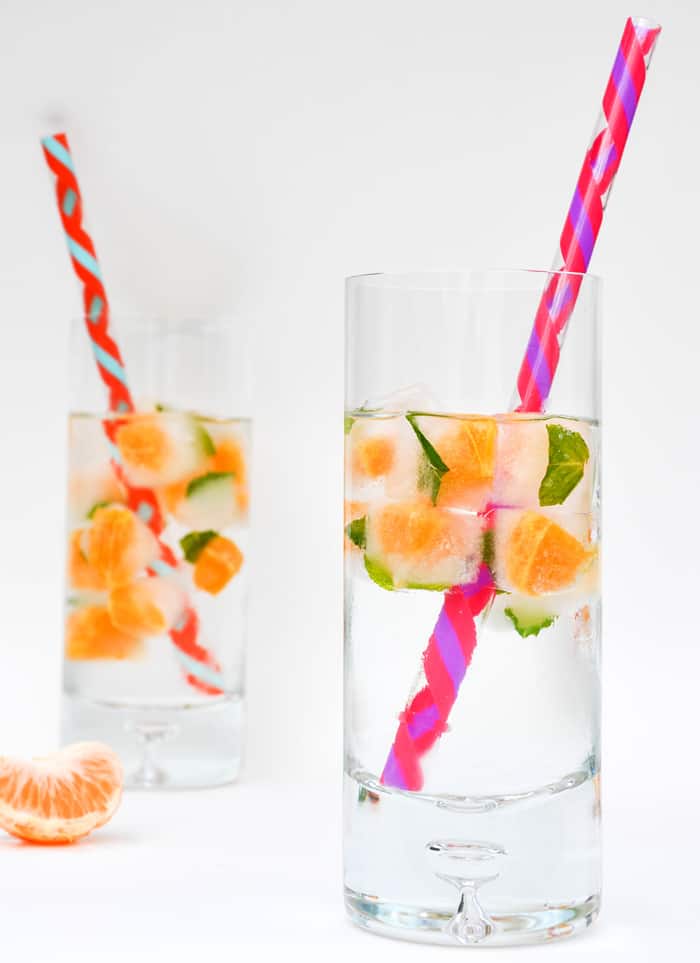 Two Glasses with Citrus Mint Ice and a Straw
