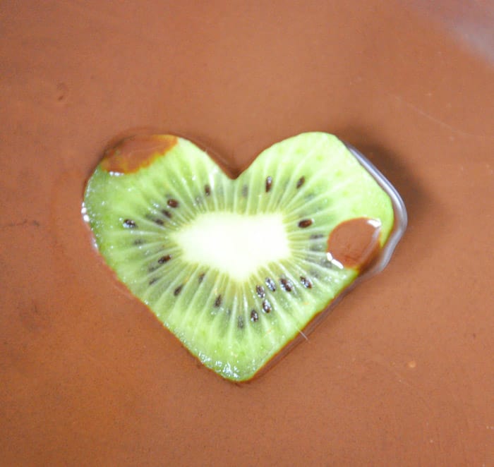 Dip the entire heart shaped kiwi into chocolate 