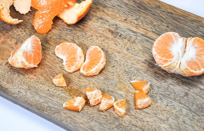 Sliced citrus into small pieces to fit into ice cube tray