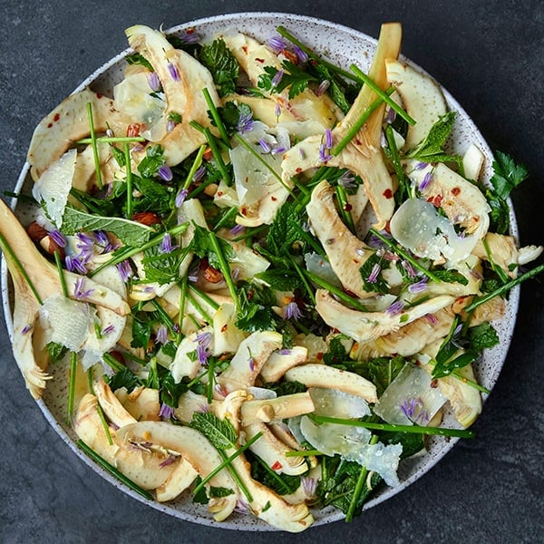 A salad with raw shaved artichokes.