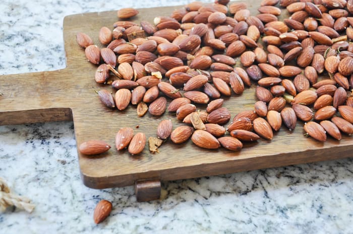 Roasted almonds on a serving board