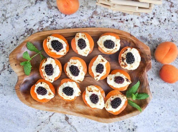 Baked apricot blackberry jewel on serving tray with mint sprigs