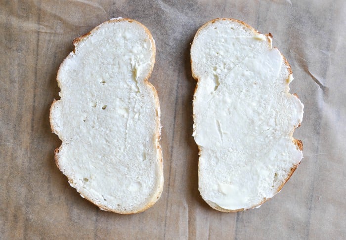 Butter spread on one side of both sides of bread
