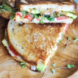 Garden Grilled Cheese - Cheesy comfort with avocado, tomato, grilled onions and microgreens