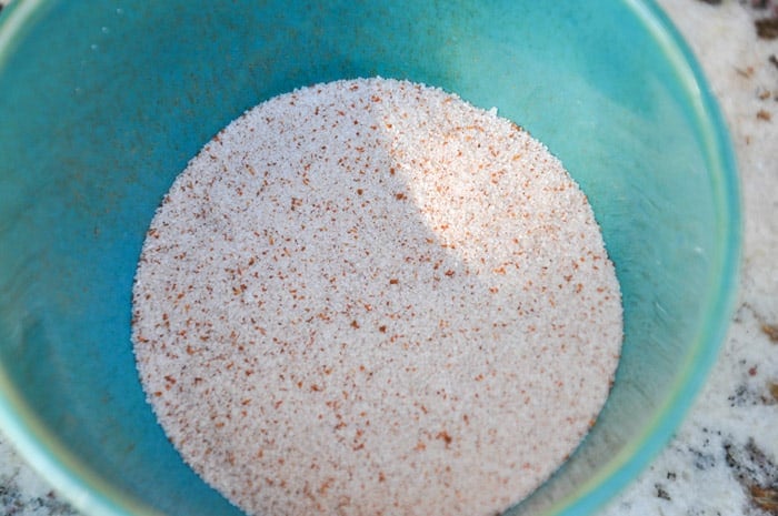 Cayenne and cinnamon laced sugar mixture in bowl