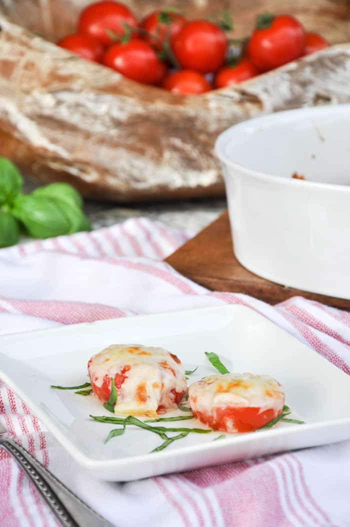 Roasted Garlic Cheese Tomatoes on Dish with Basil Strips