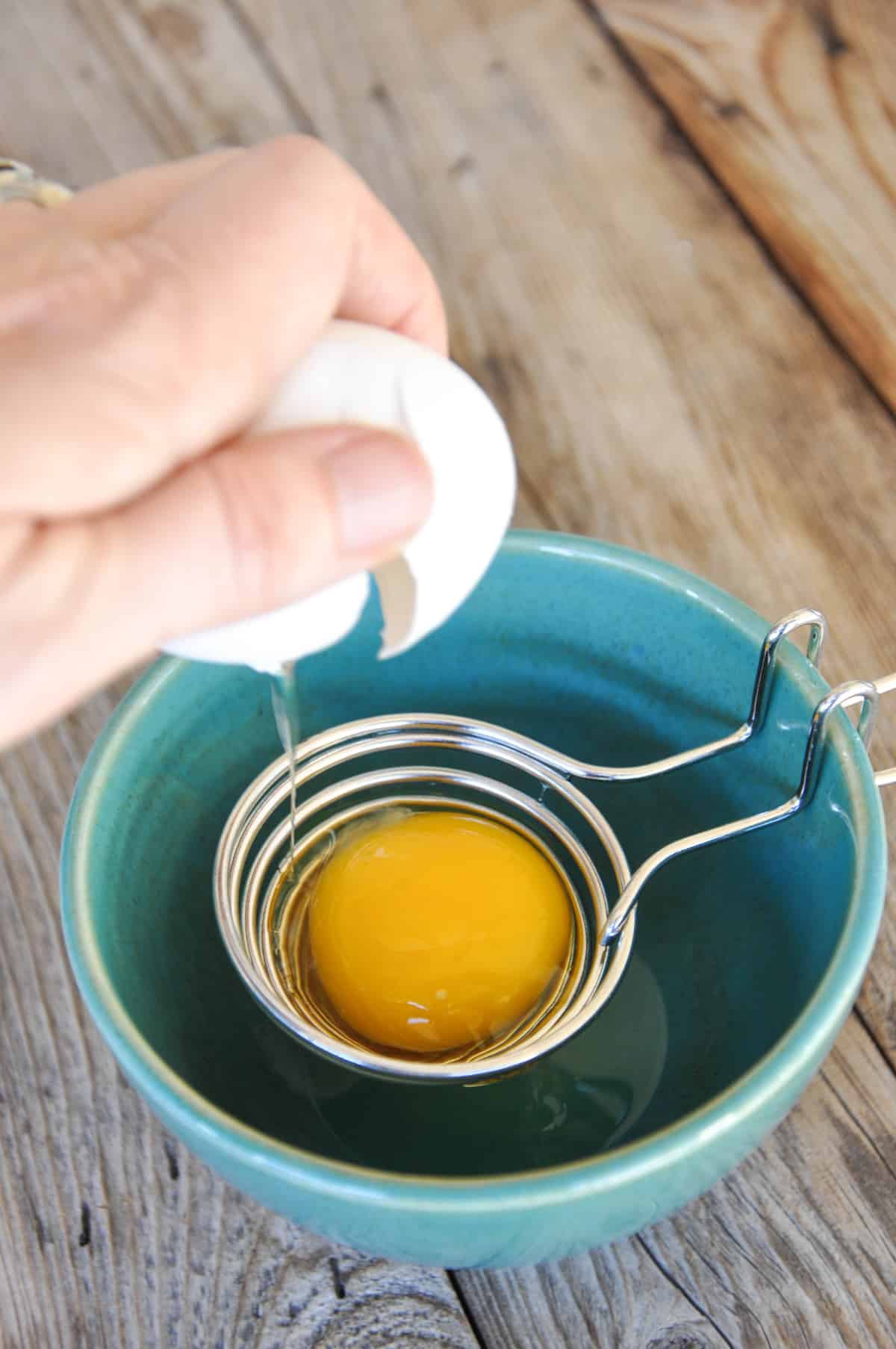 Cracking egg over egg separator to only get the egg whites