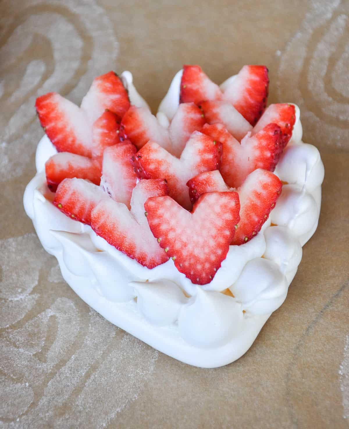 Top meringue with sliced strawberries