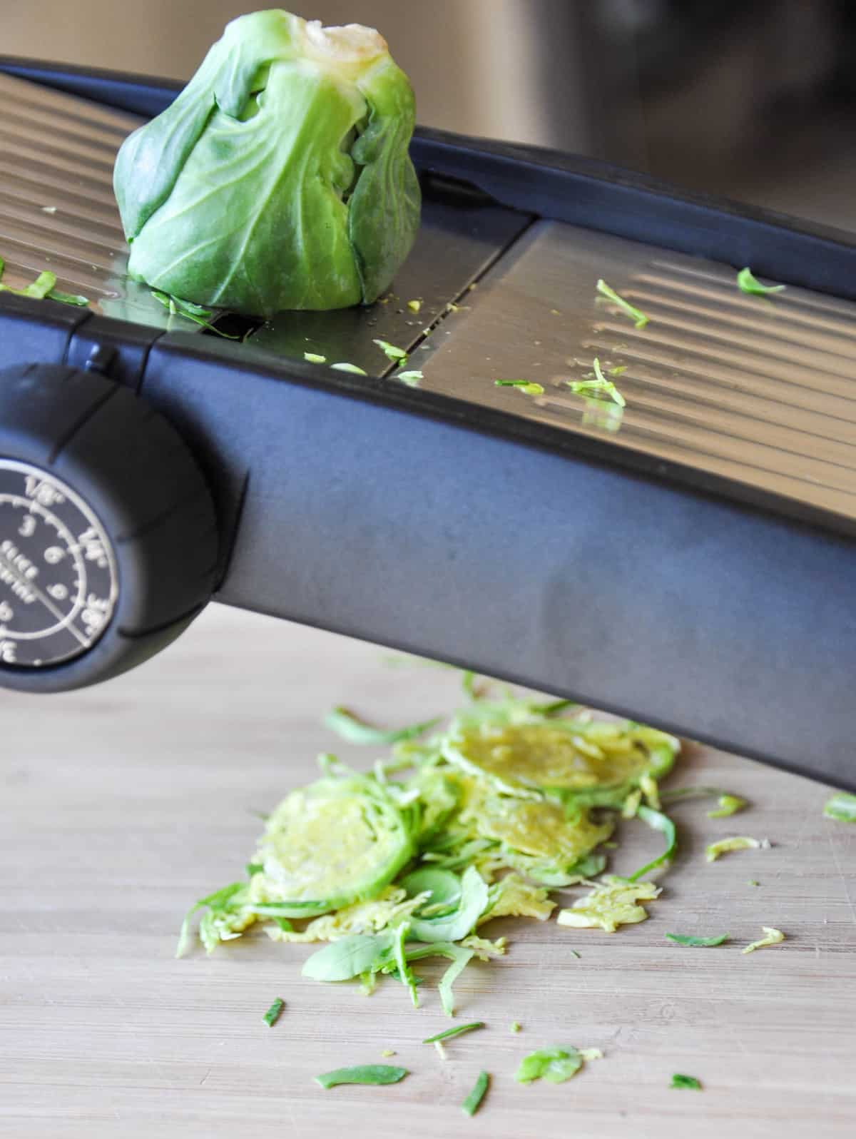 Slicing a Brussels Sprout with a mondoline 