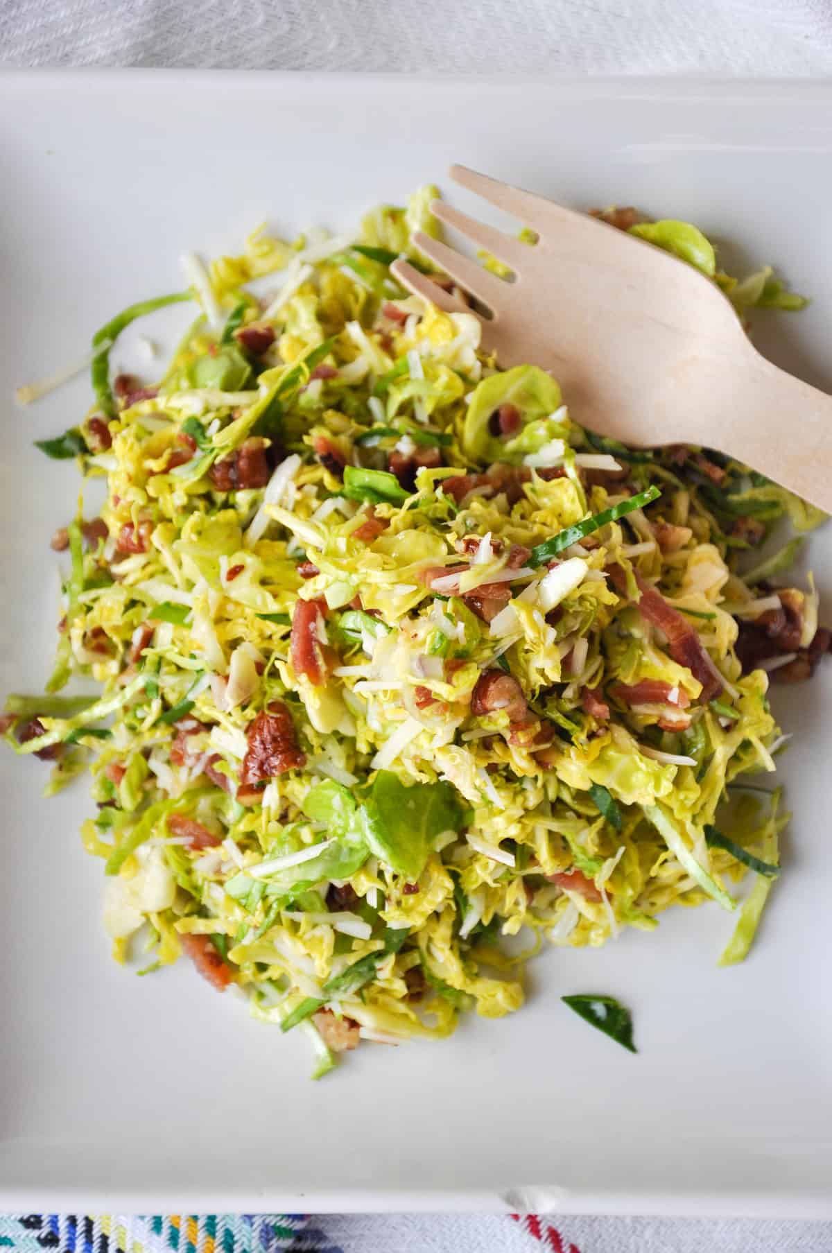 Bacon Pecan Brussel Sprout Salad with Maple Orange Dressing on a plate