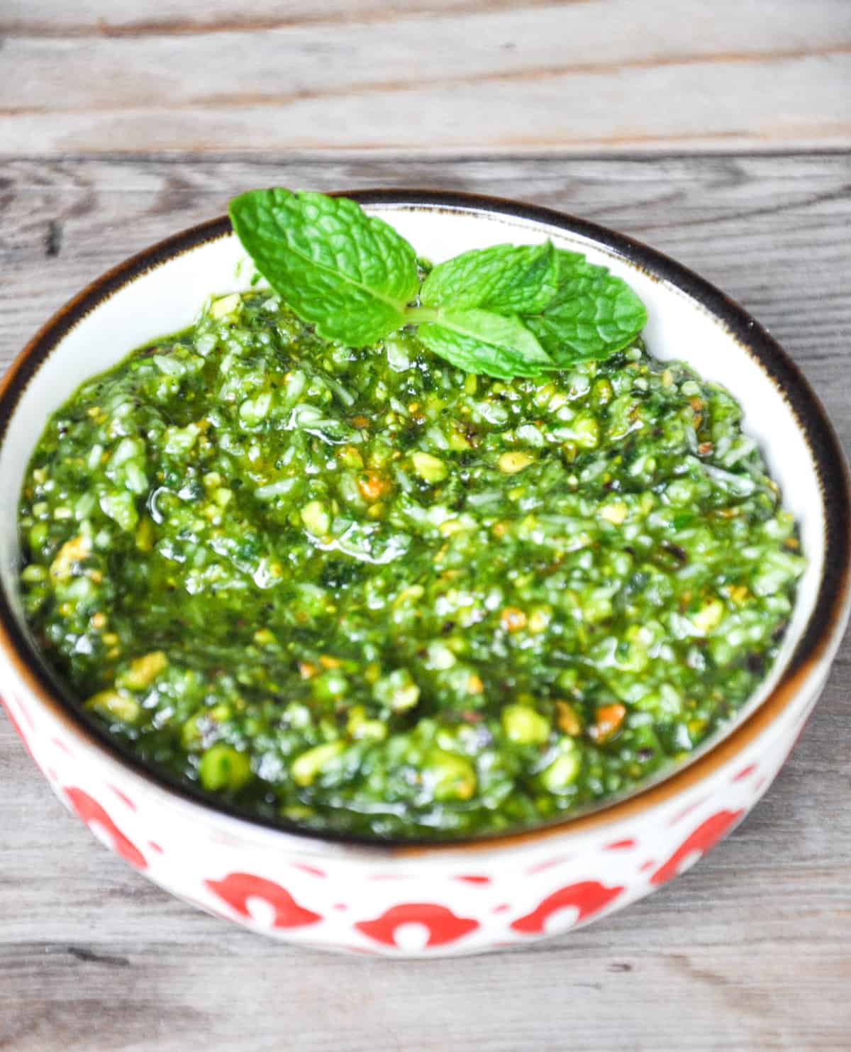 Pistachio Mint Pesto topped with mint in a bowl