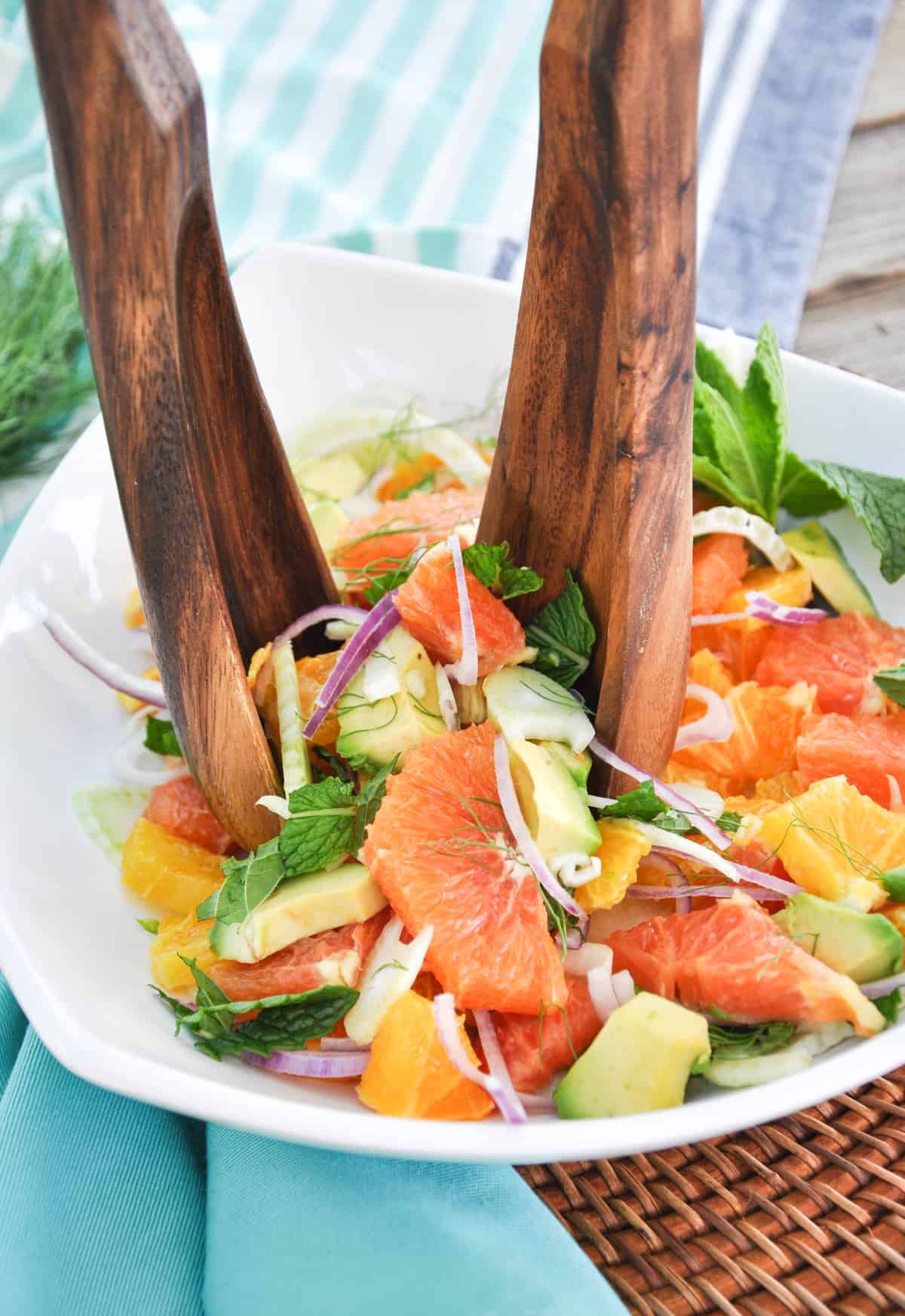 Utensils picking up Citrus Spring Salad