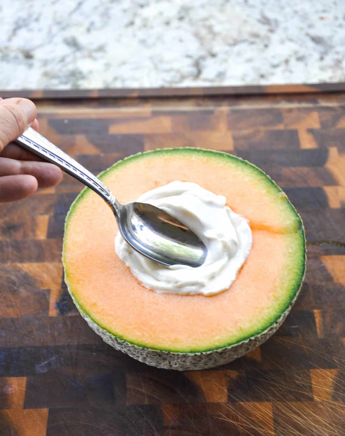 Cantaloupe Breakfast Bowls. Perfect for dessert too! Load the center with greek yogurt and top with fresh berries and granola. YUM!