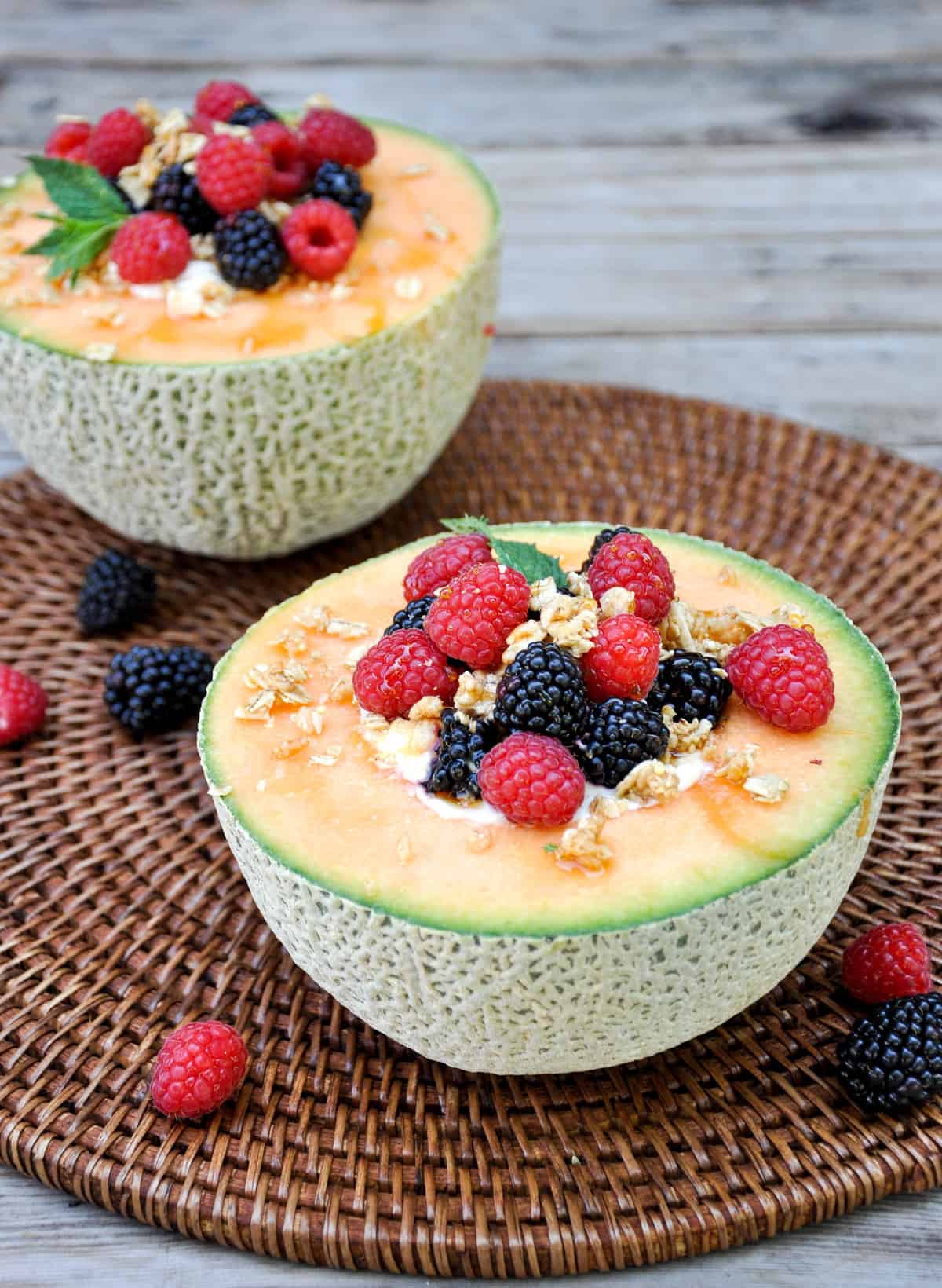 Cantaloupe Breakfast Bowls. Perfect for dessert too! Load the center with greek yogurt and top with fresh berries and granola. YUM!