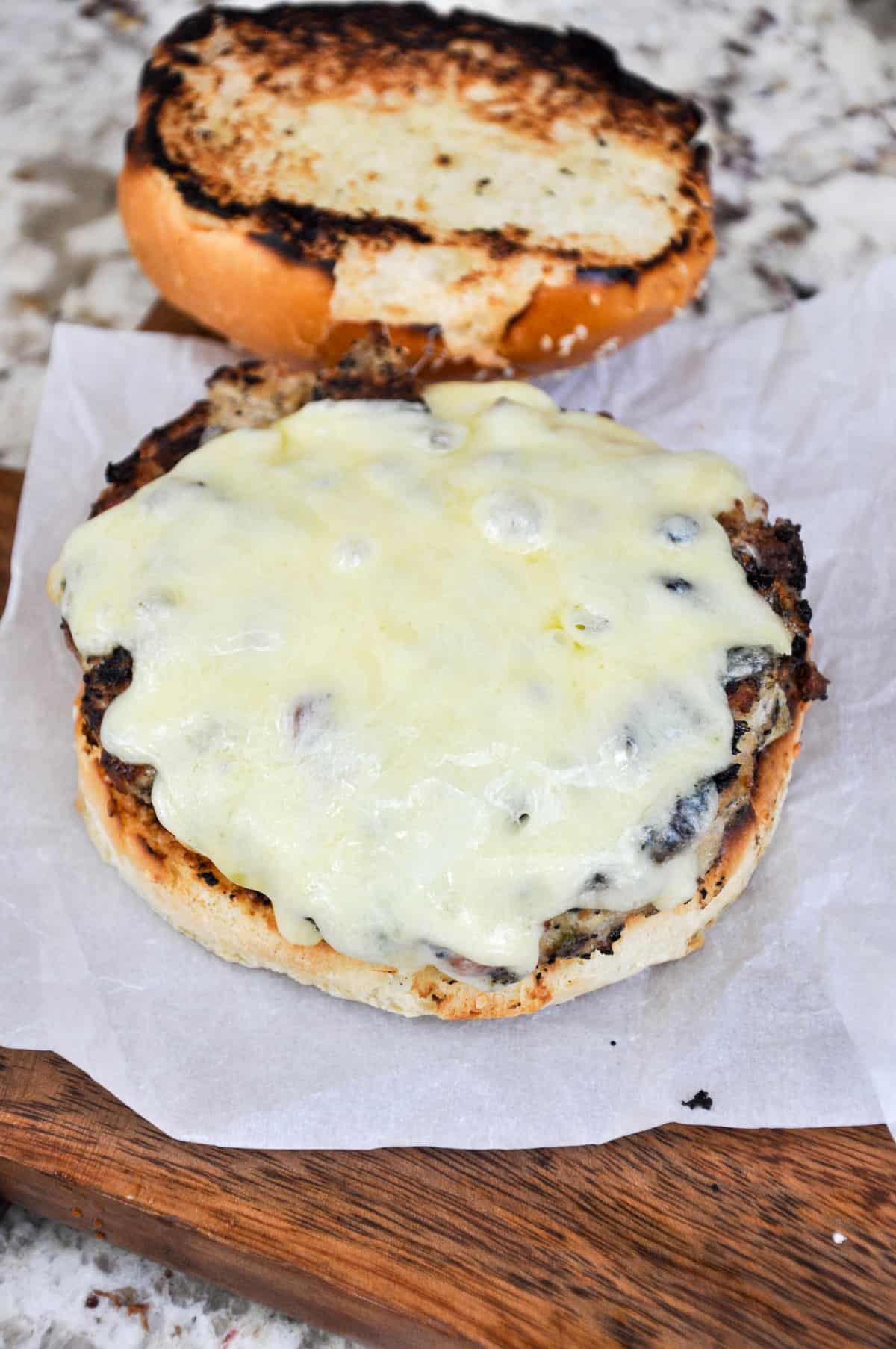 White cheddar cheese melted over turkey patty 