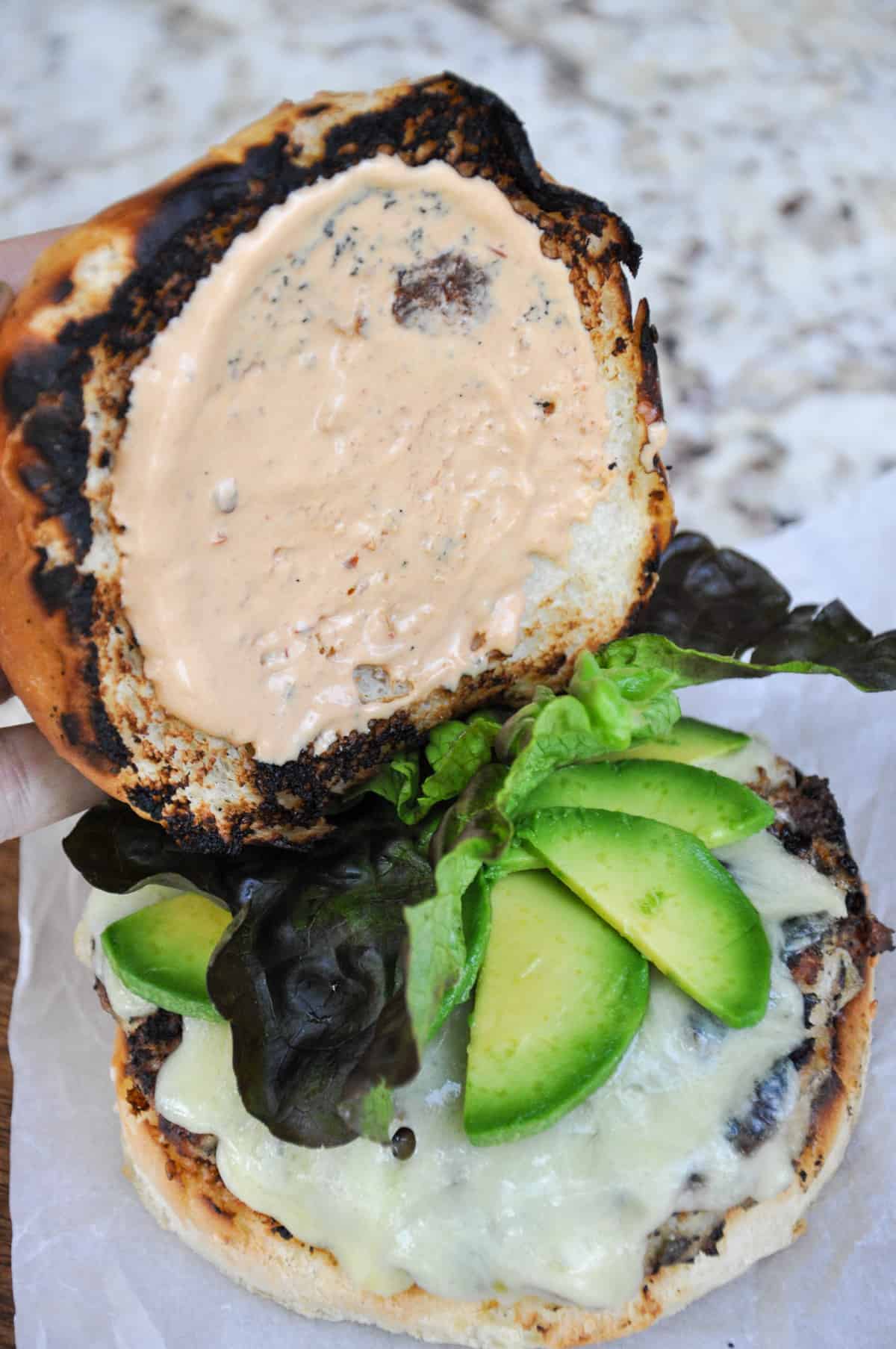Additional chipotle aioli on other piece of bun 