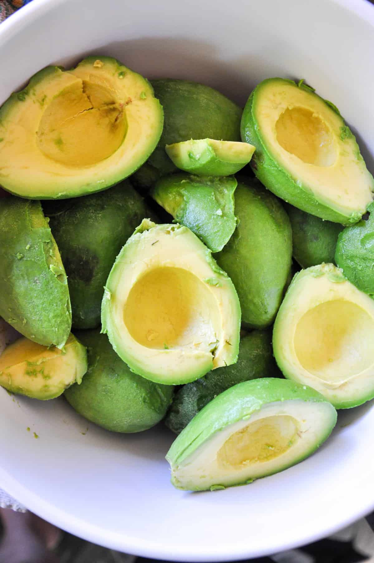 Halved avocados in a bowl