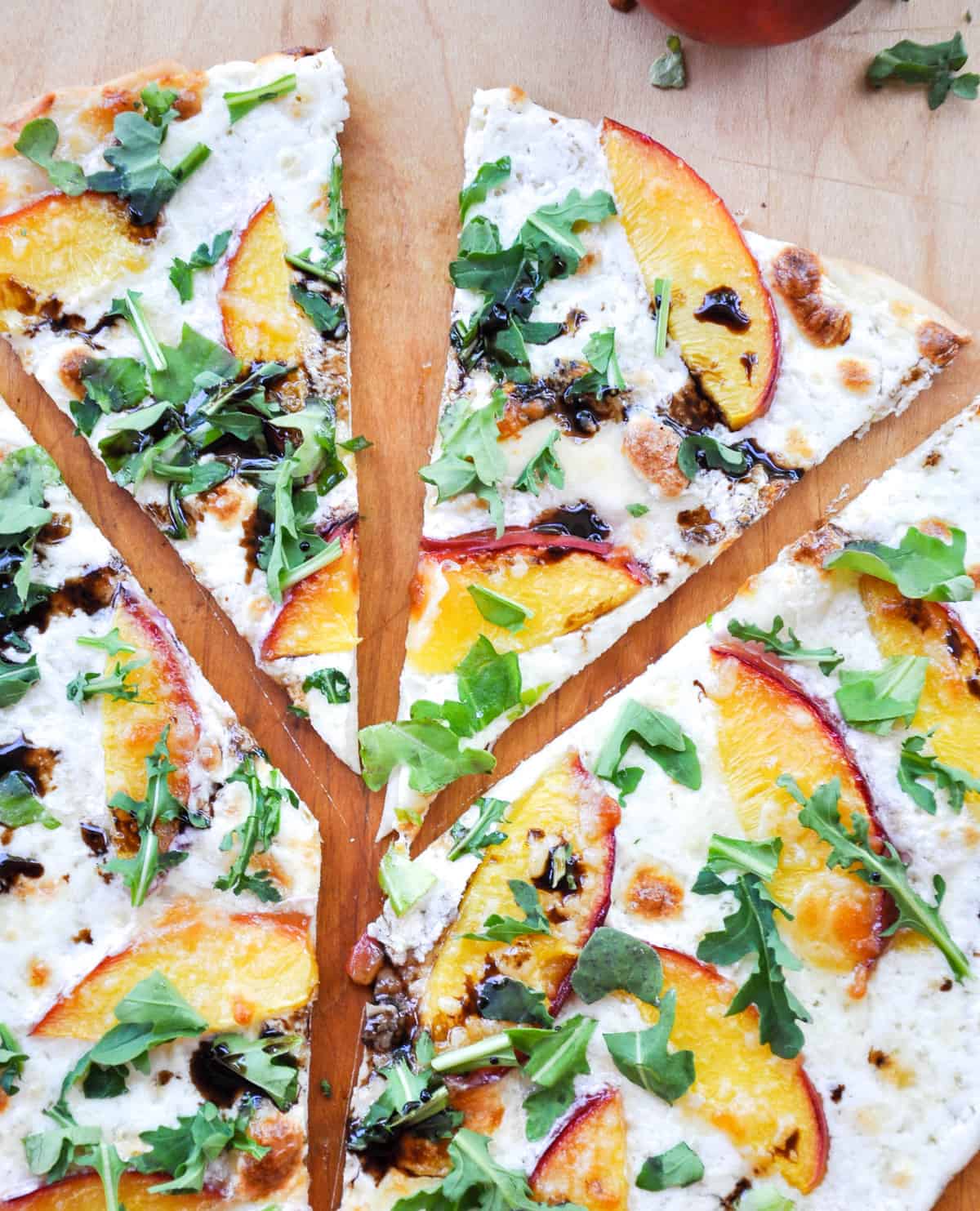 Sliced Nectarine Arugula Pizza