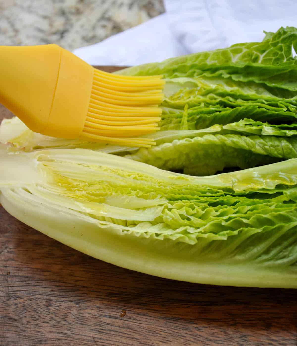 Olive oil spread on romaine head