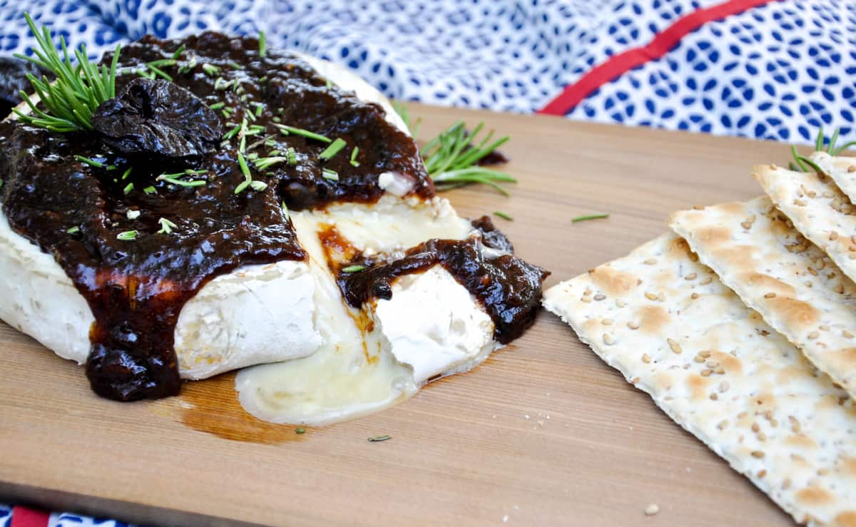 Cedar Planked Brie topped with Dried Plum Rosemary Sauce