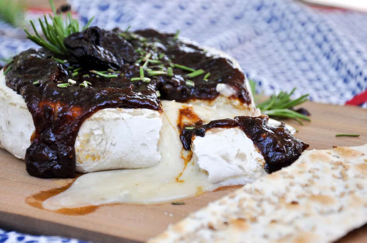 Cedar Planked Brie topped with Dried Plum Rosemary Sauce