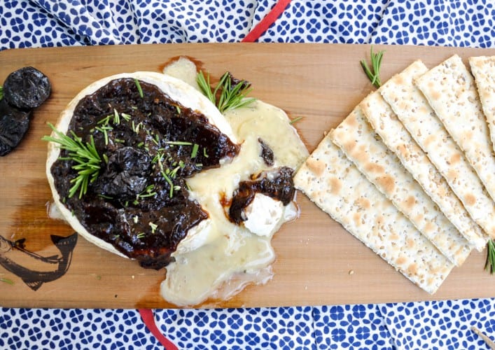 Cedar Planked Brie topped with Dried Plum Rosemary Sauce