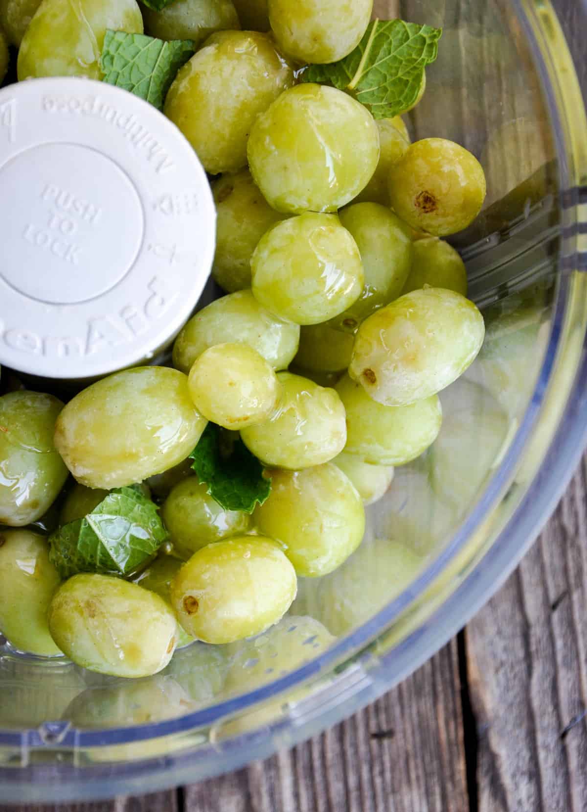 Green grapes and mint in food processor 