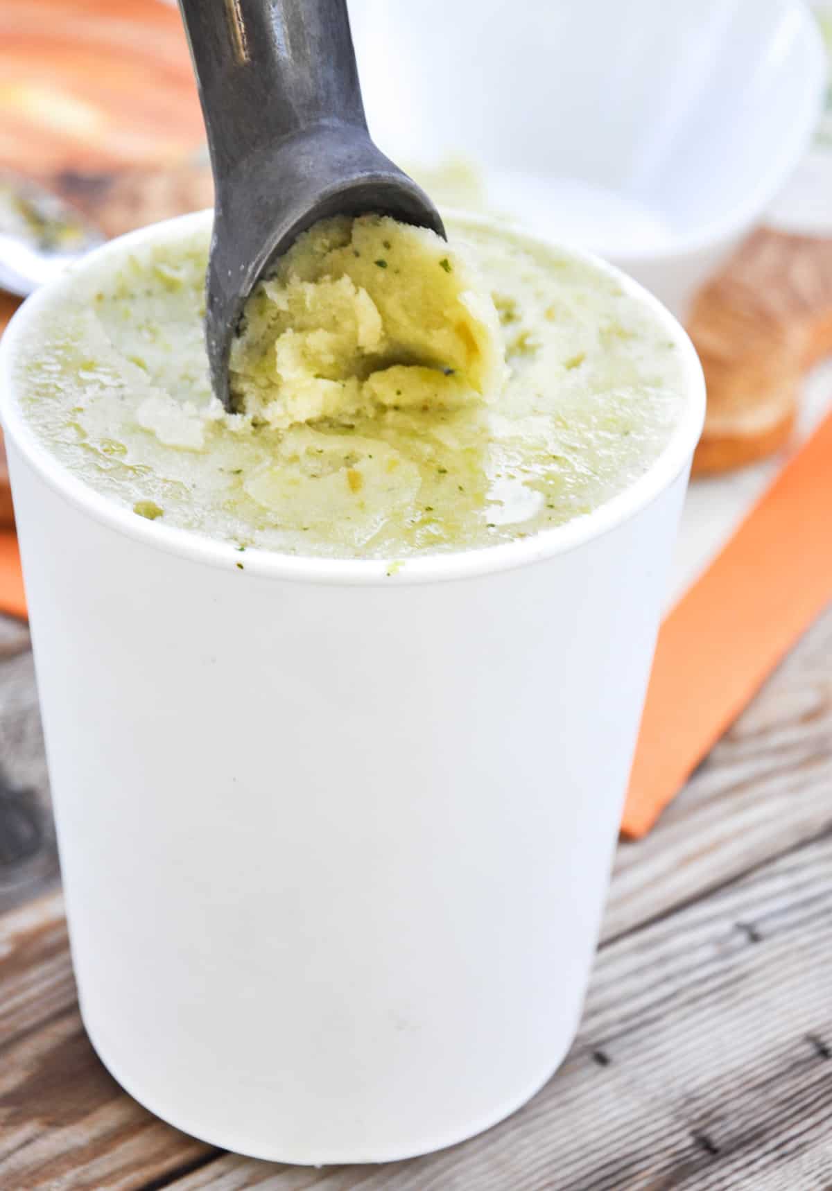 Green Grape Sorbet with fresh mint and lime in cup being scooped