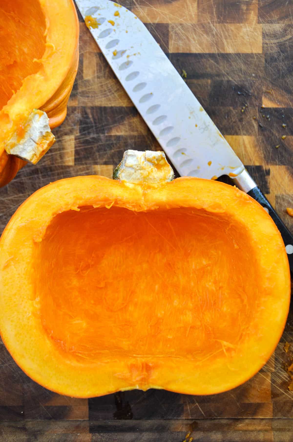 Halved pumpkin with seeds and pulp removed 
