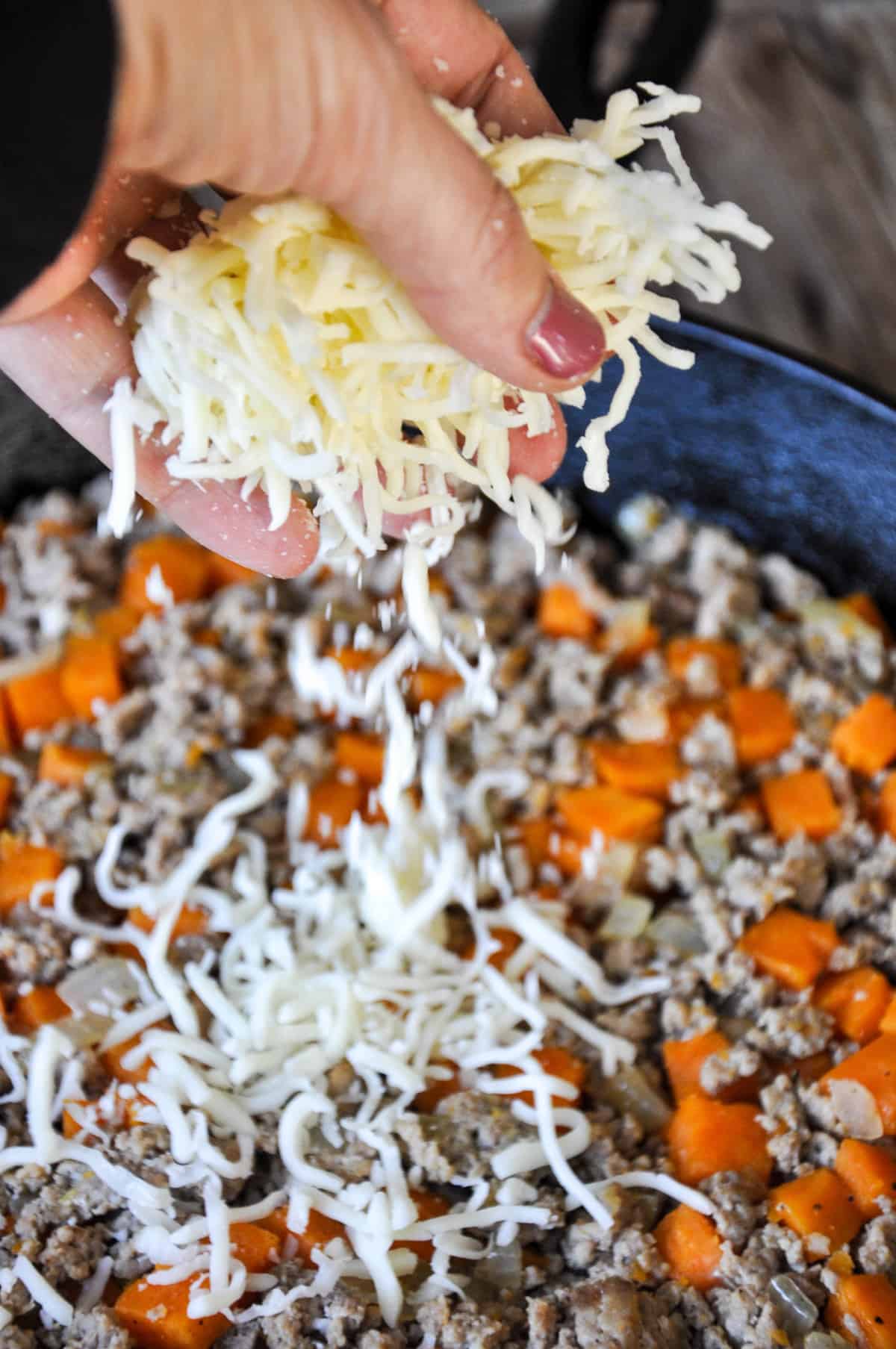 Cheese being added to Ground Turkey and Sweetpotatoes