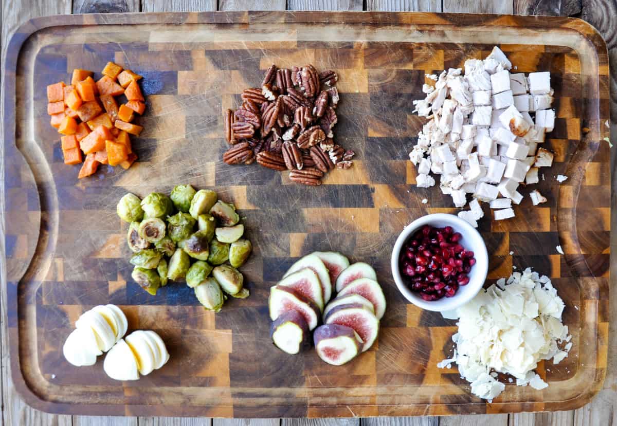 Thanksgiving Surplus Salad Ingredients: butternut squash, brussels sprouts, figs, pecans, pomegranates, hard boiled eggs, turkey. 