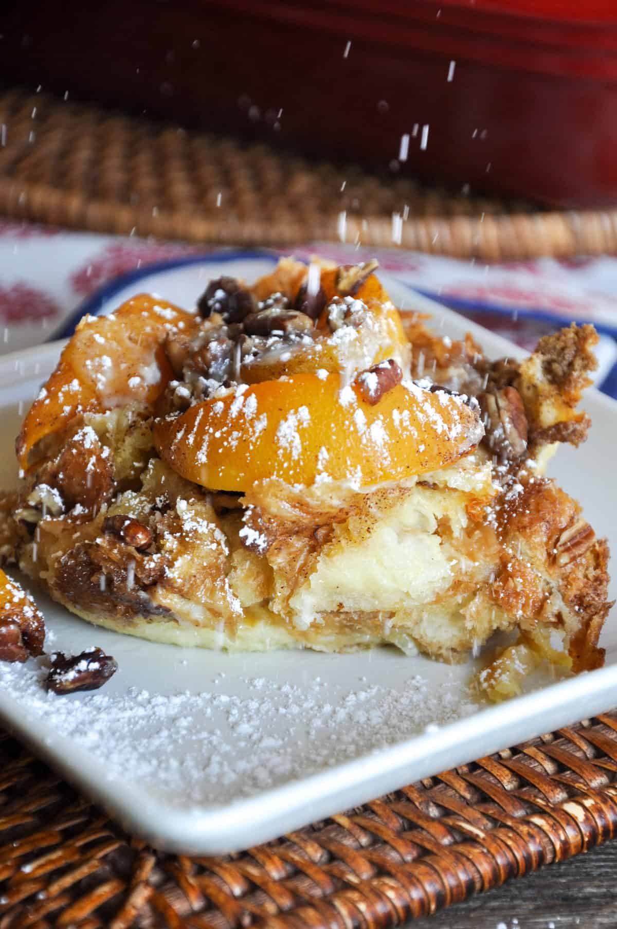 Sprinkle Powdered Sugar over Peaches and Cream Overnight French Toast