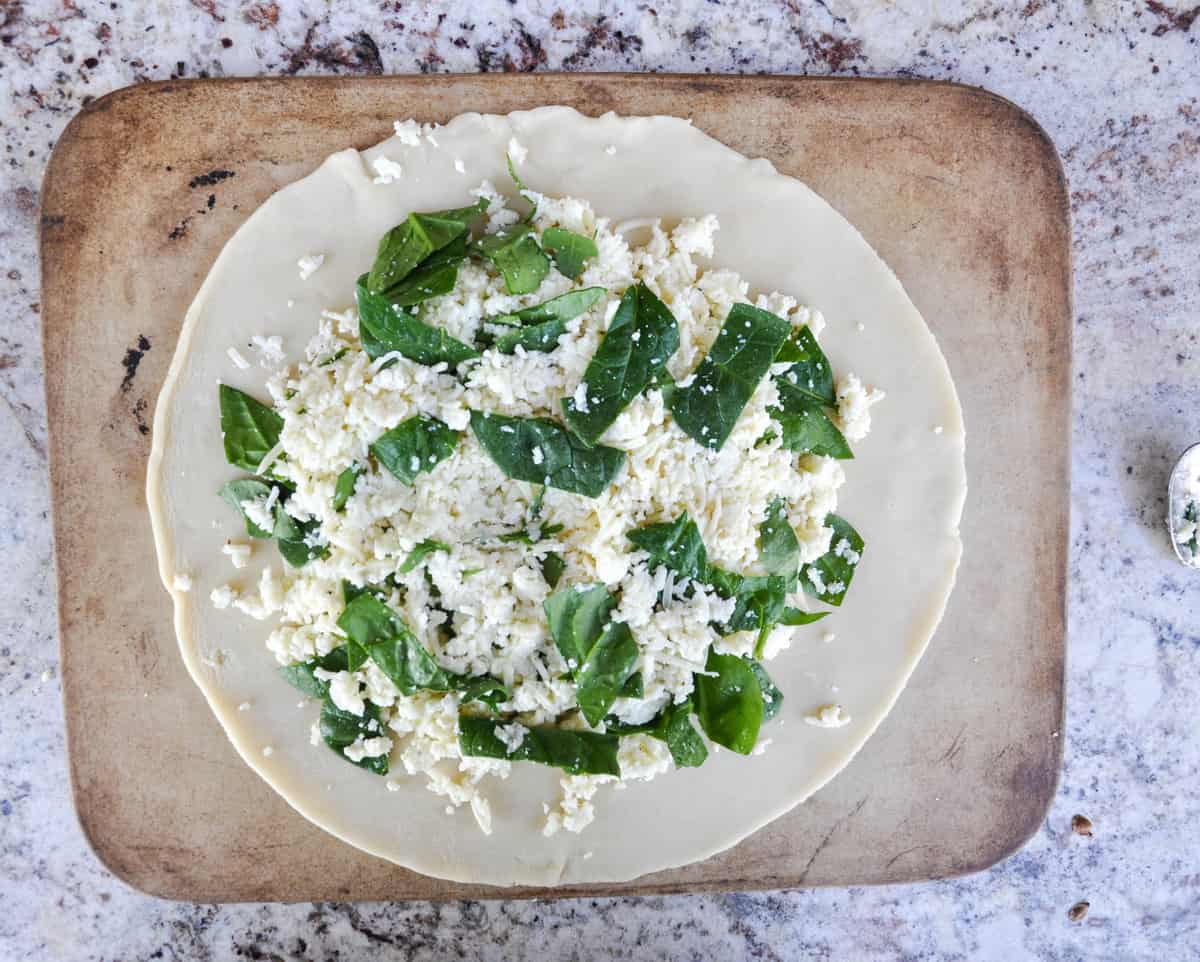 Spinach and cheese mixture on pie crust