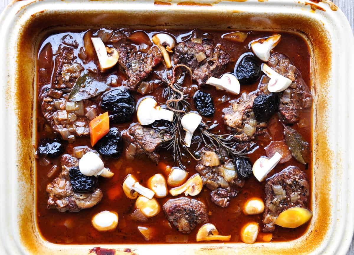 Add prunes and mushrooms an hour before stew is done cooking 