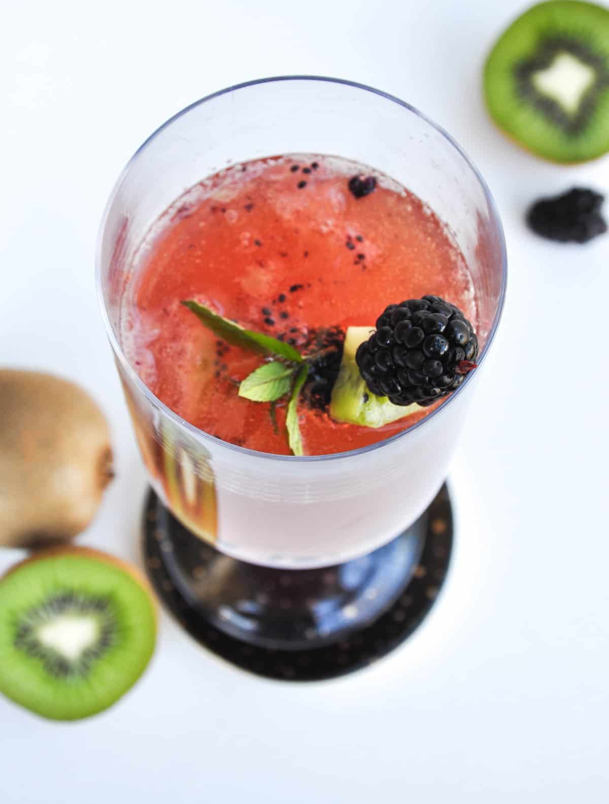 Blackberry Kiwi Mimosa with blackberry, kiwi skewer as garnish 