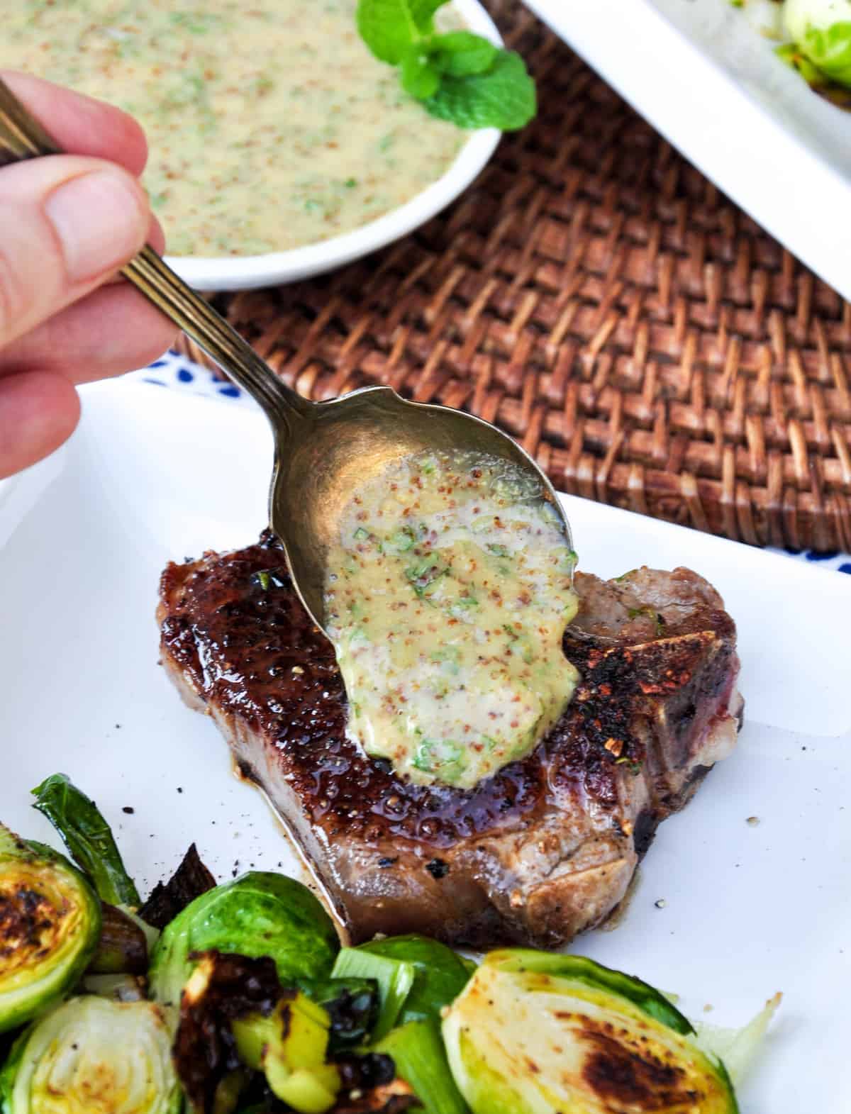 Serve lamb chops with mustard mint sauce 