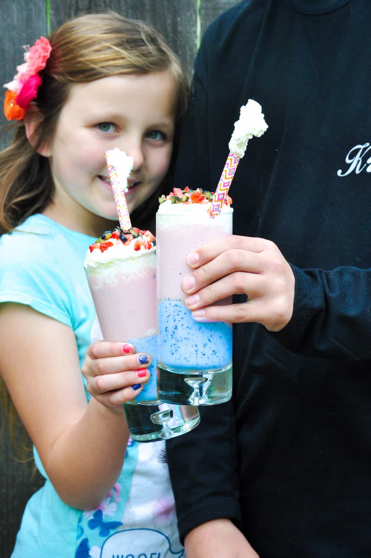 Children holding unicorn smoothie