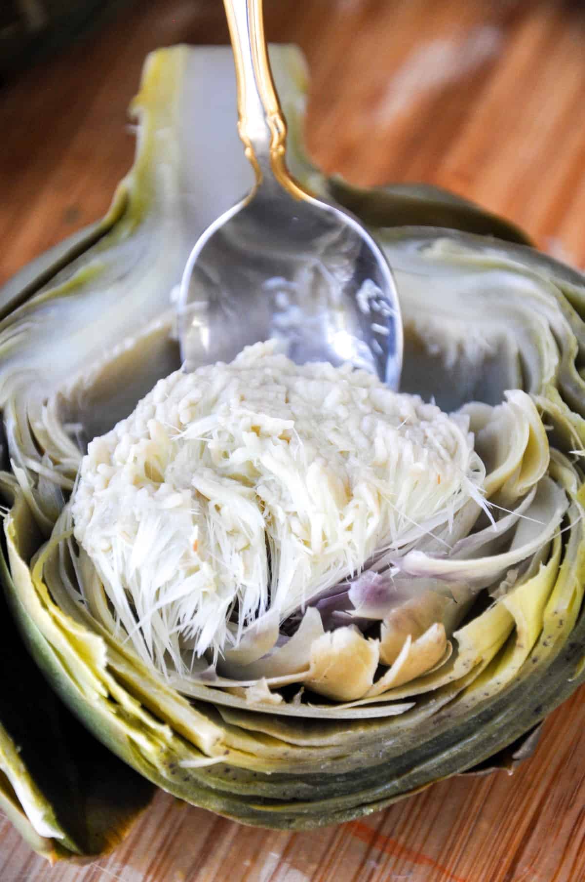 Remove flesh of artichoke with spoon