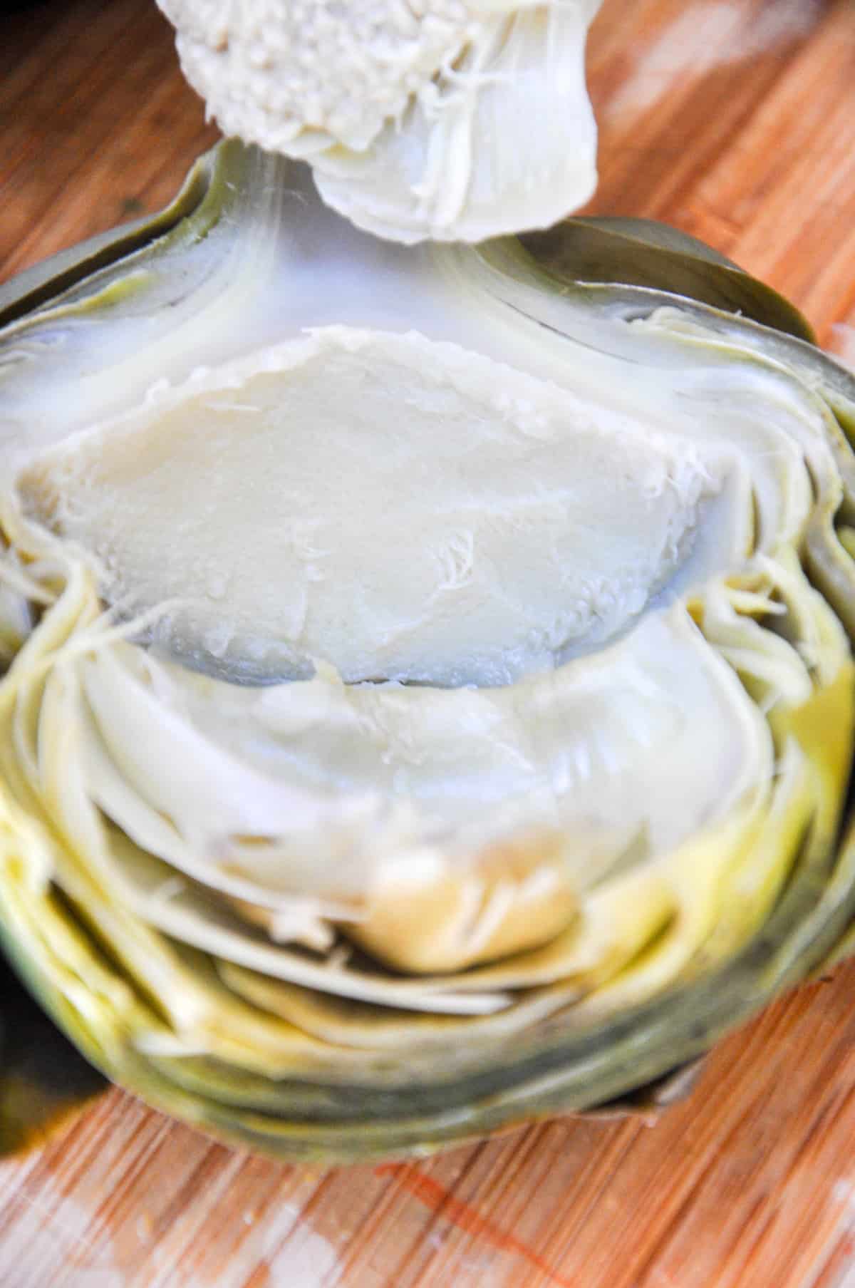 Remove flesh of artichoke with spoon