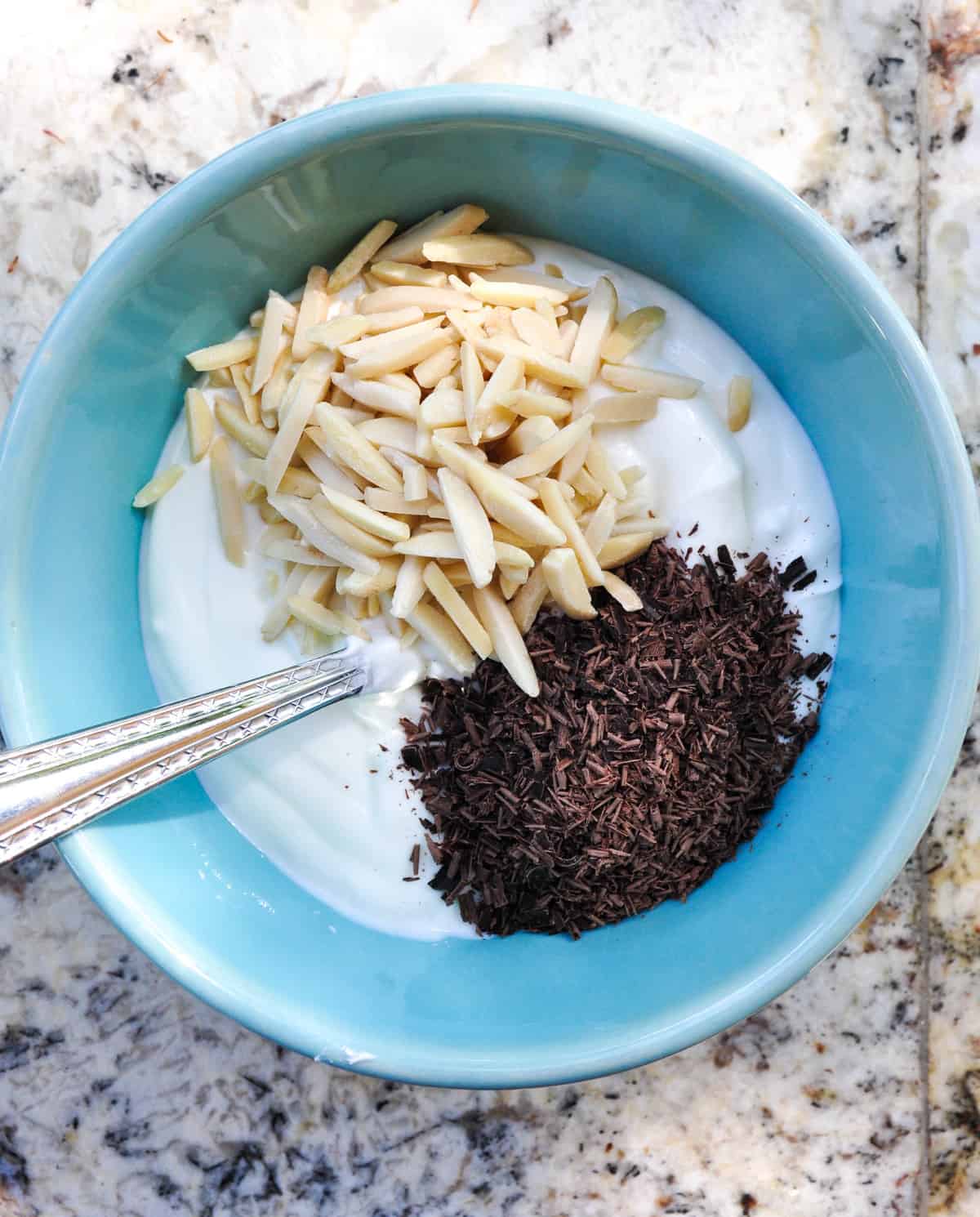 Yogurt, slivered almonds, and shaved dark chocolate 