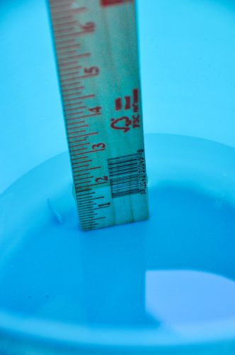 Measuring water in an ice bucket for a DIY.