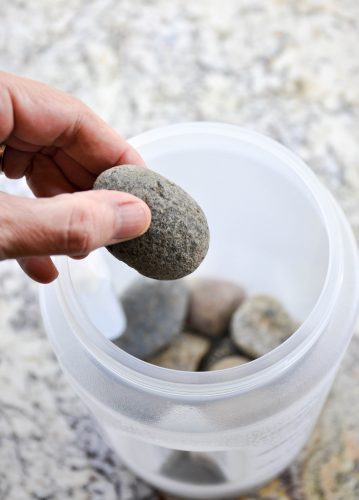 How to make a floral ice bucket - secure the inner mild by placing rocks in the bottom of the smaller bucket. 